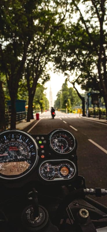 Vintage Motorcycle Dashboard Scenic Road Mobile Wallpaper