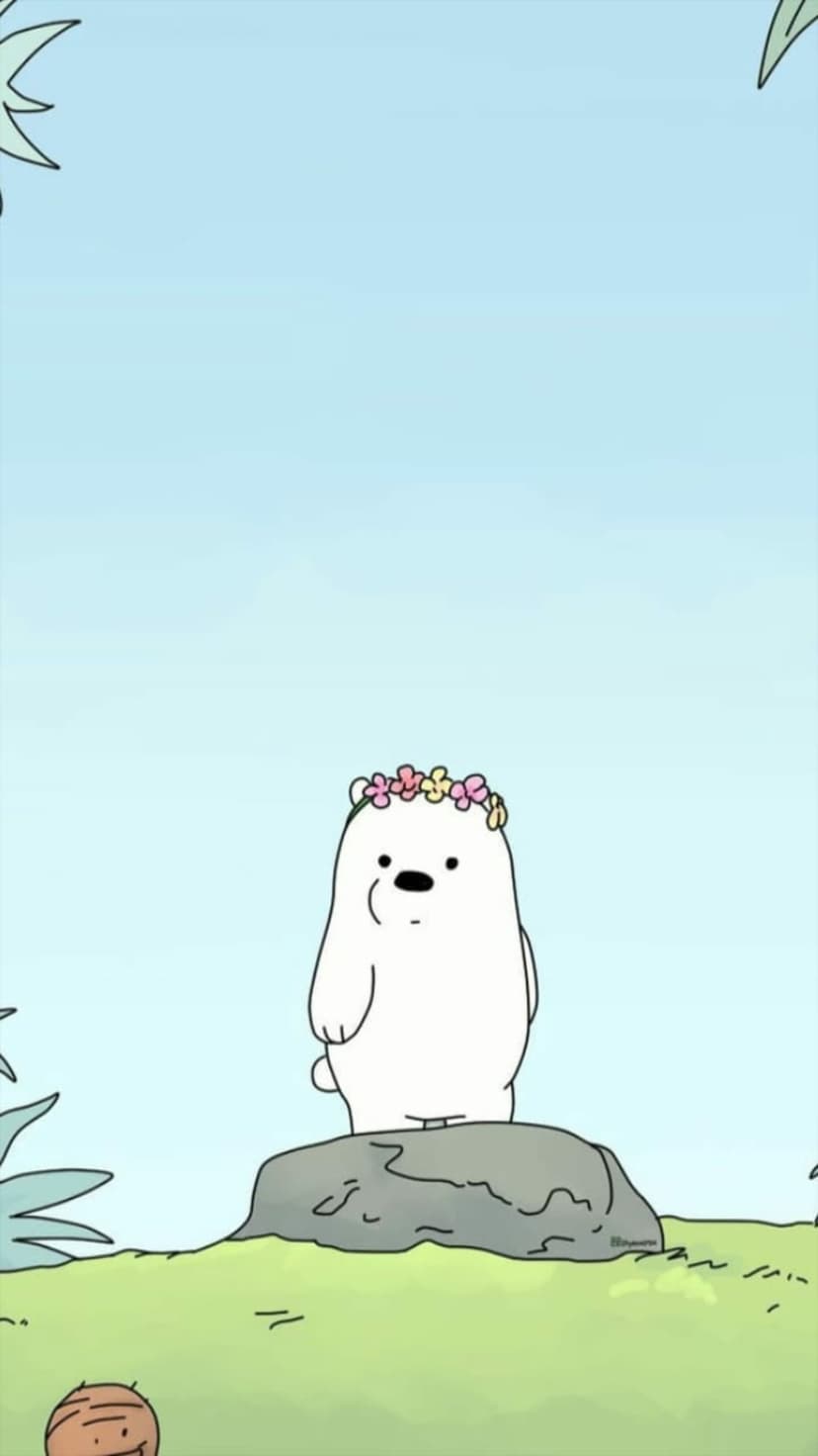 Polar bear wearing a flower crown stands on a gray rock amidst green grass and tropical leaves under a blue sky.