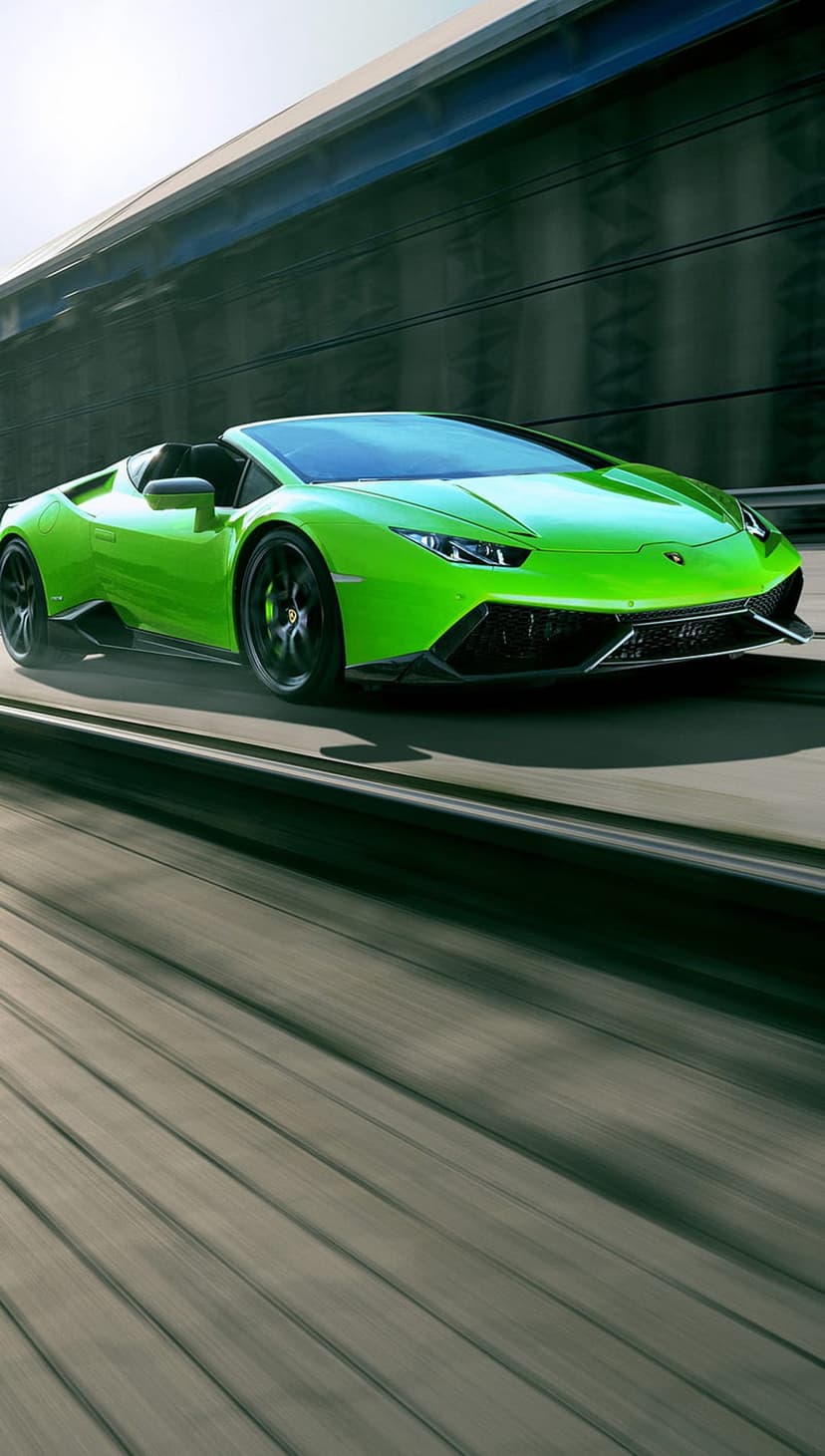 Lime green Lamborghini Huracan convertible speeding on a road with motion blur and low-angle perspective.