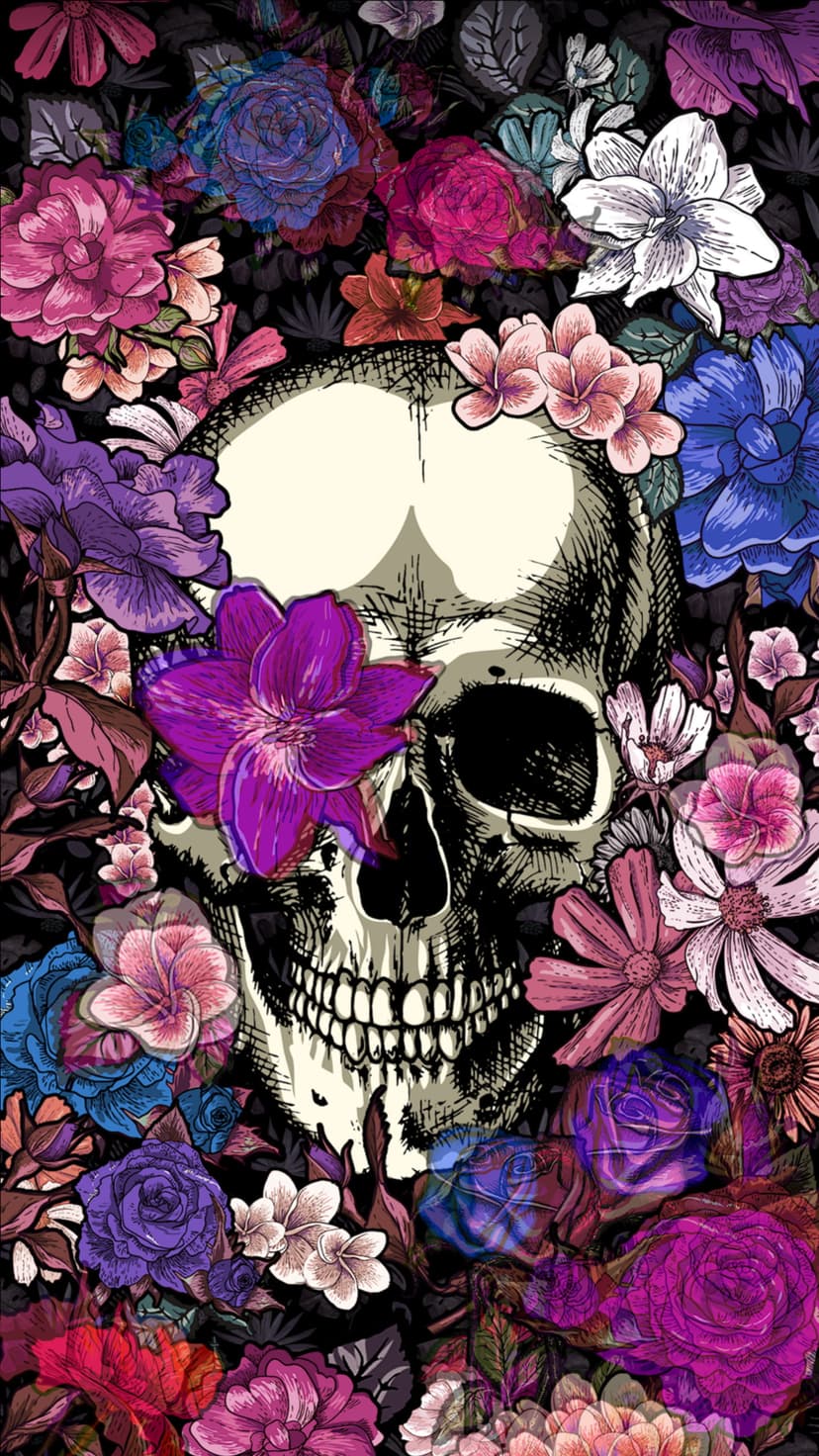 Human skull decorated with vibrant purple and red flowers against a solid black background for a moody effect.