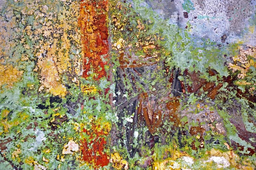Verdigris-coated copper surface features crusty turquoise patina, orange rust spots, and charcoal gray metallic flaking.