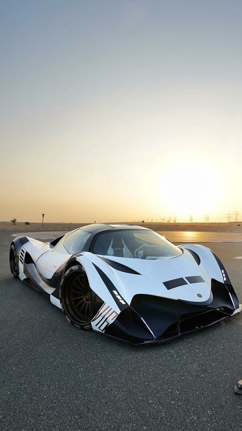 Devel Sixteen hypercar with a white and black body parked on asphalt during a hazy, warm-toned sunset backdrop.