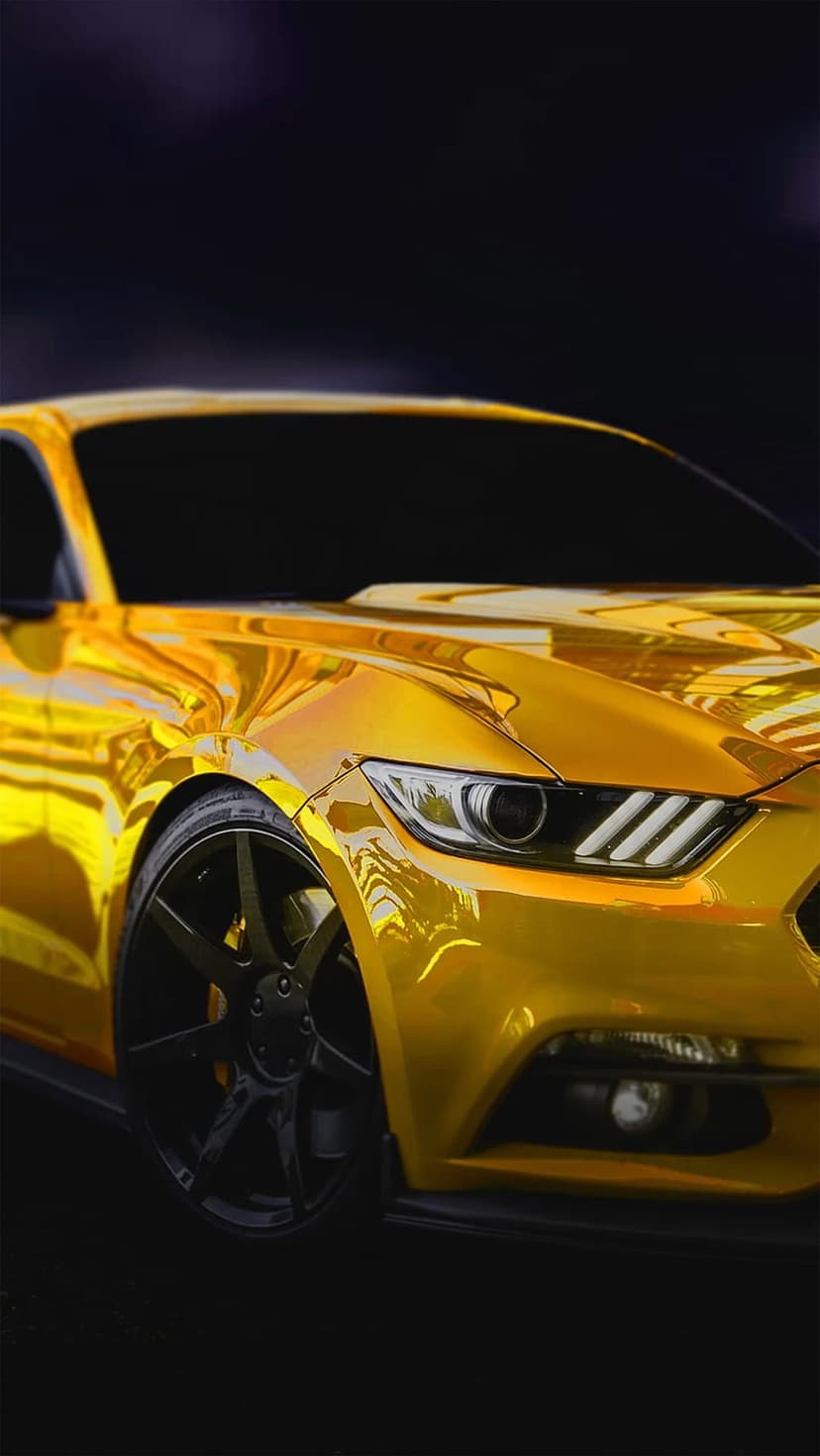 Golden chrome Ford Mustang featuring a muscular hood and sleek headlights in a front-facing perspective.