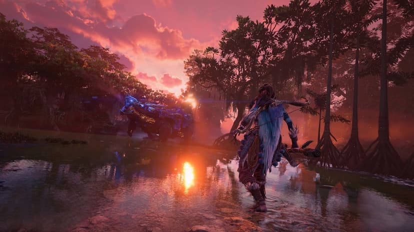 Horizon Forbidden West landscape featuring metallic machines amidst lush green tropical forests and mountains.