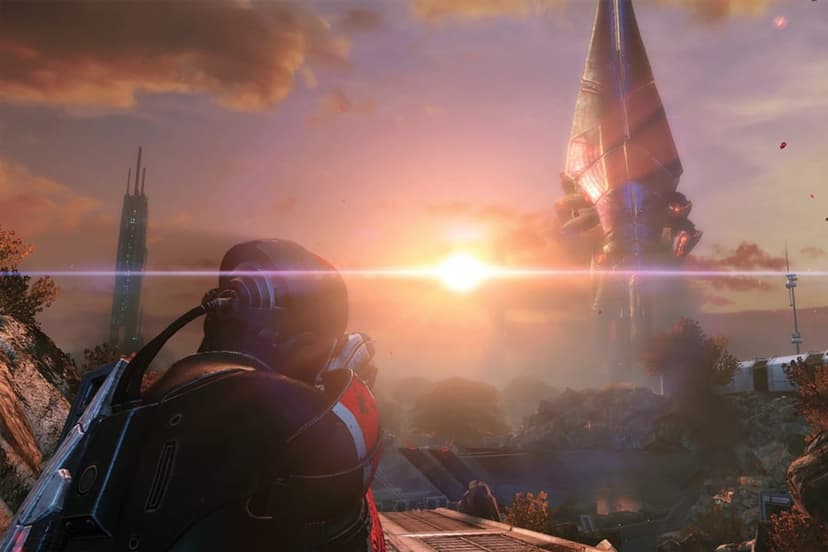 Soldier in N7 armor views a giant needle-shaped tower against a bright orange sunset and distant city.