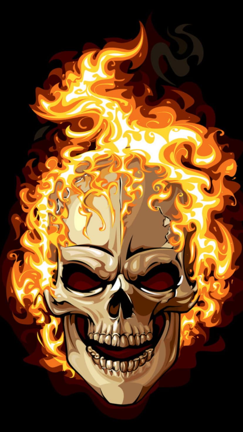 Human skull with a wide grin and glowing red eyes is surrounded by intense orange and yellow flickering flames.