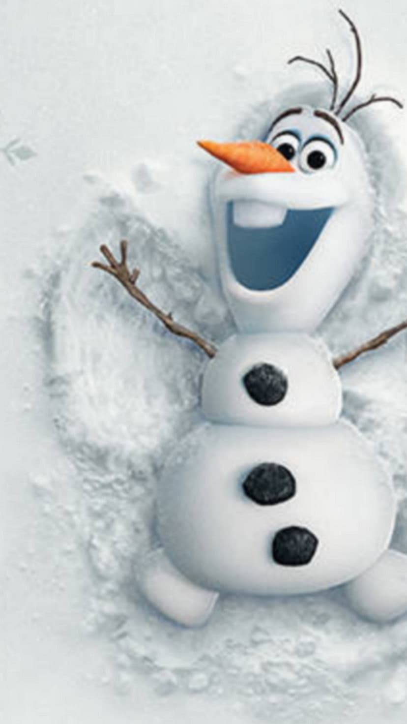 Olaf the snowman lies in fresh snow with arms and legs outstretched to create a classic snow angel shape.