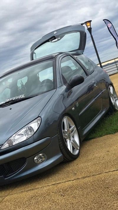 Modified Peugeot 206 with custom wheels and lowered suspension