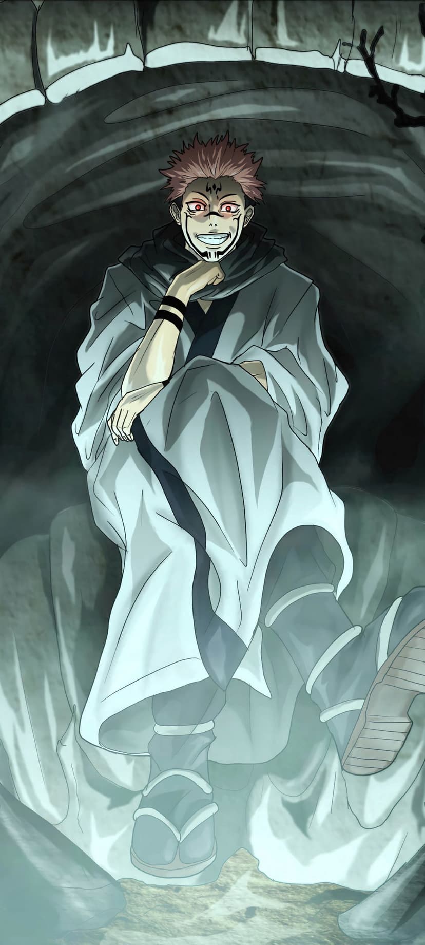 Ryomen Sukuna sits with a hand on his chin, featuring red spiky hair, facial markings, and a taunting smirk in a cave.