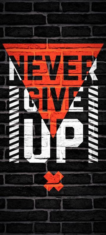 Never Give Up Motivational Typography on Brick Wall