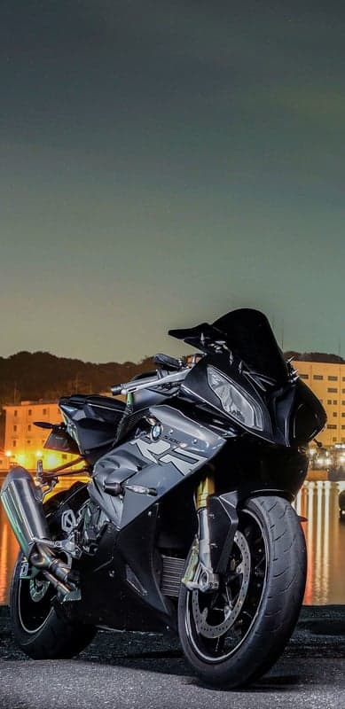 Black BMW S1000RR Motorcycle at Night by the Water