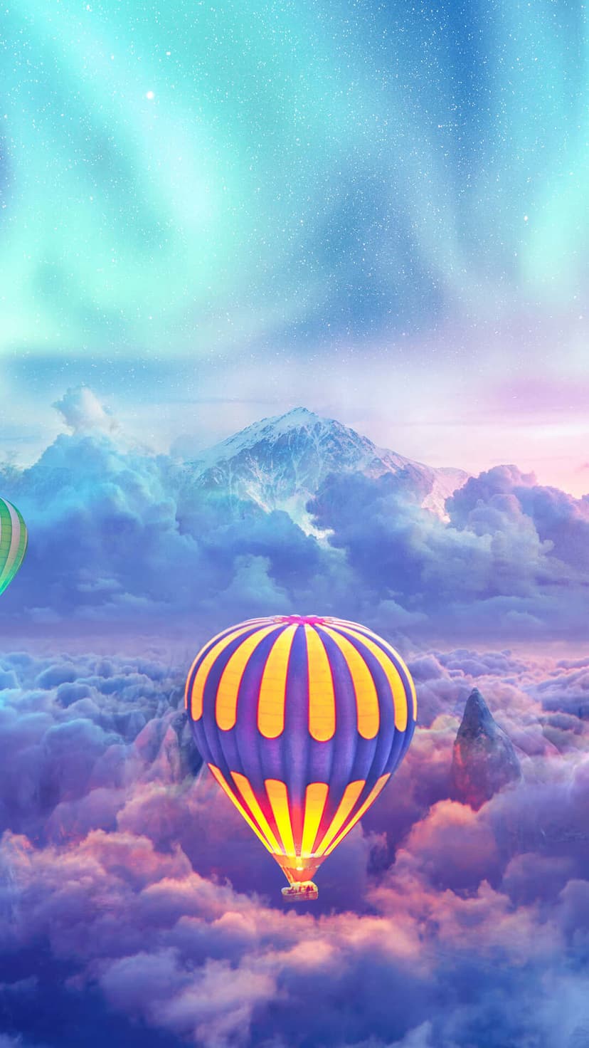 Colorful hot air balloons floating above soft pastel clouds and a distant snow-capped mountain under a starry sky.