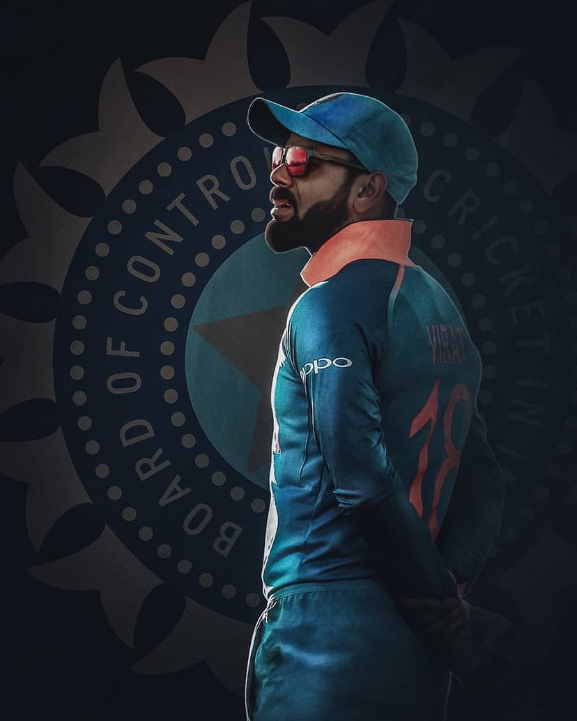 Virat Kohli wears a blue India cricket jersey and cap with tinted sunglasses in a sharp side profile portrait.