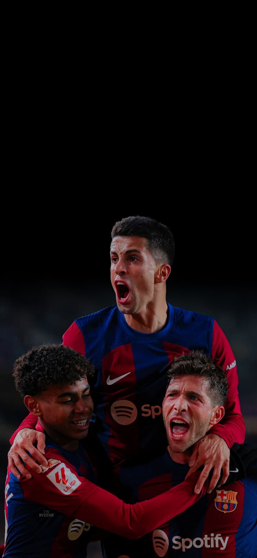 Barcelona players shout and embrace in a victory huddle wearing blue and red kits against a dark background.
