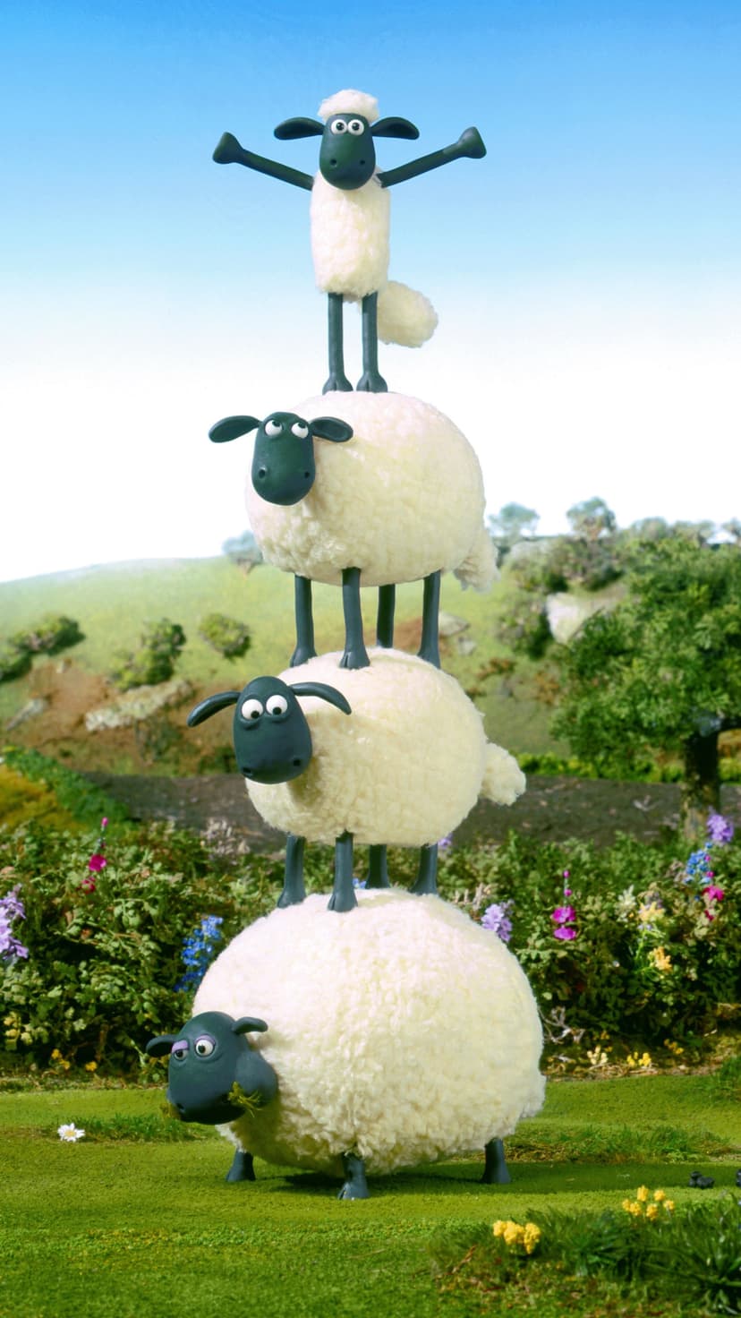 Four claymation sheep stack in a vertical tower on a green hill under a bright blue sky with colorful flowers.