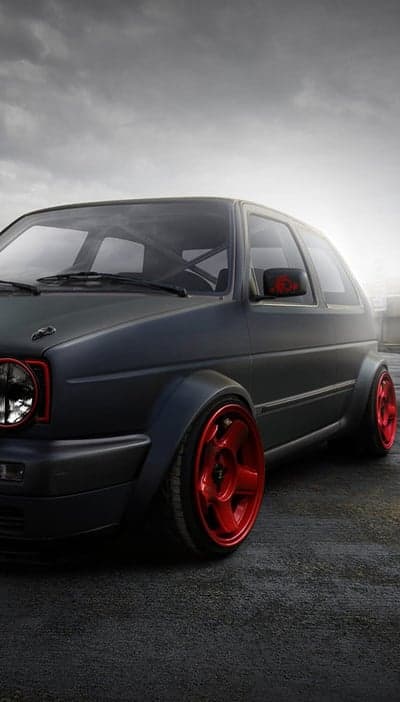 Matte Black VW Golf with Bright Red Wheels