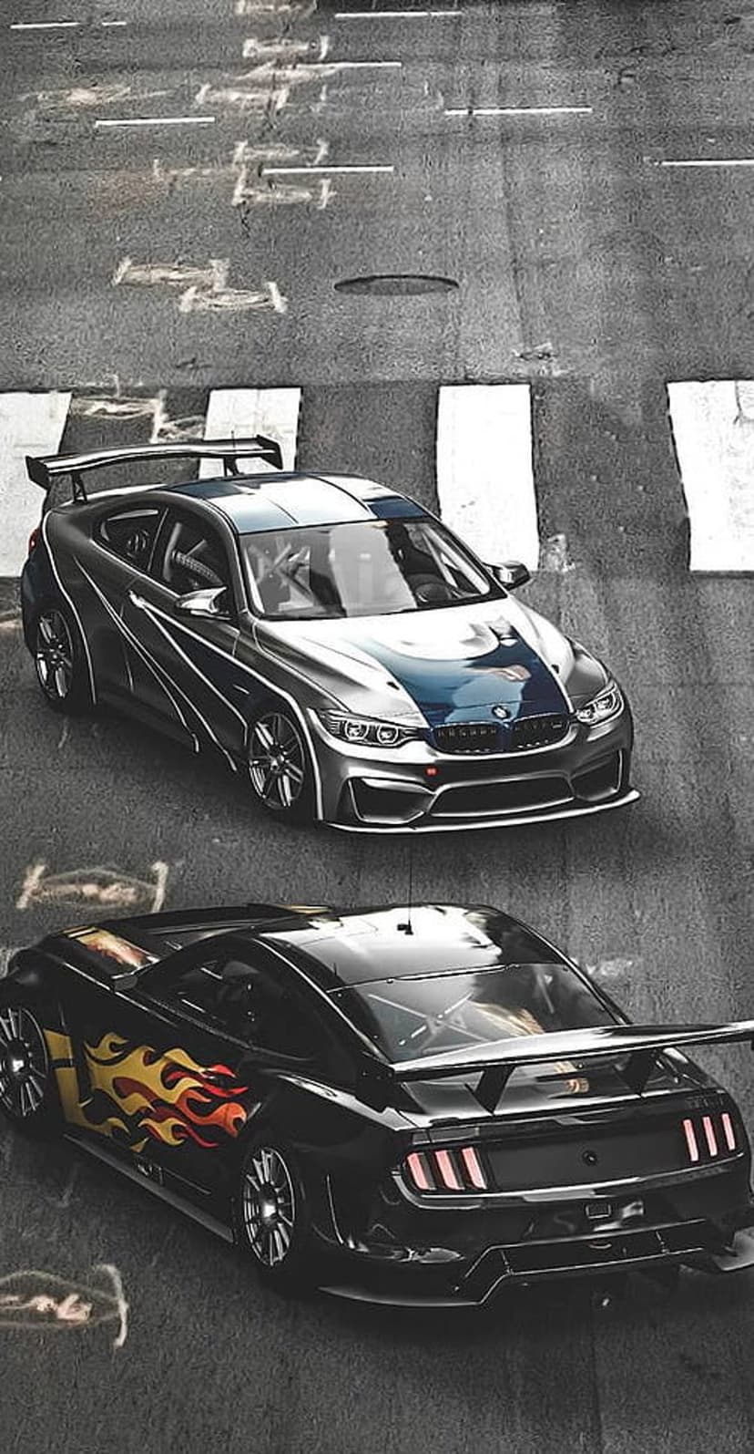 BMW M4 with blue stripes and a black Ford Mustang with flame decals sit on a textured asphalt race track.