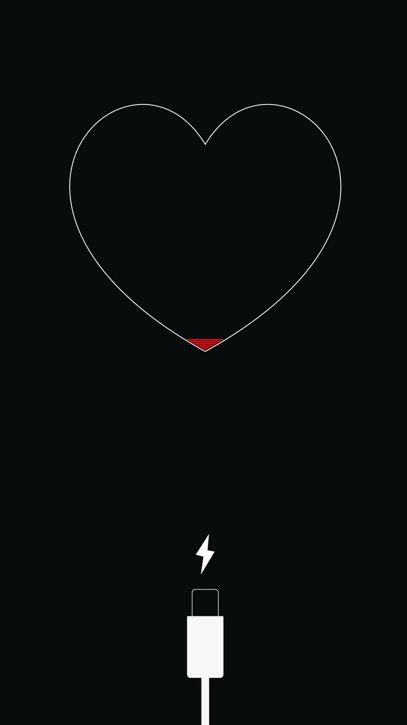 White heart outline filled with red at the base connects to a charging cable against a solid black background.