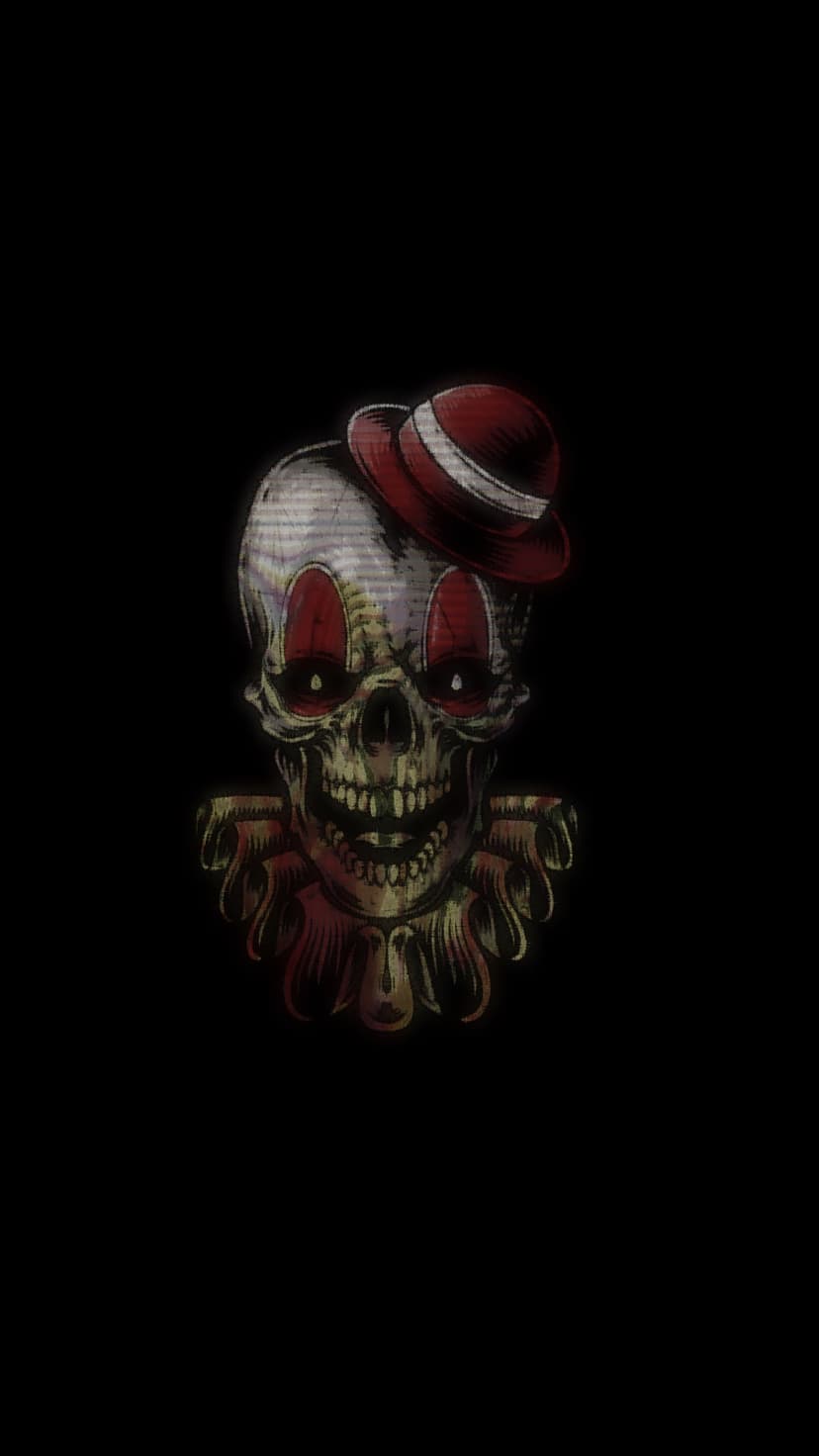 Clown skull wearing a tiny red top hat and large white ruffled collar against a solid black backdrop.