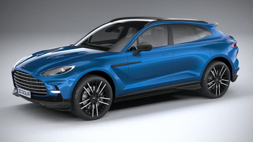 Blue Aston Martin DBX SUV with black multi-spoke wheels in a bright studio against a gray background.