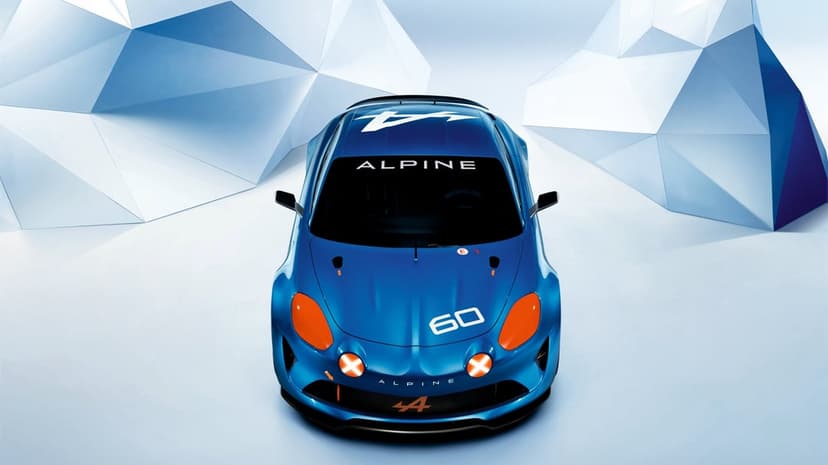 Top-down view of a blue Alpine sports car with orange accents against white polygonal geometric shapes.