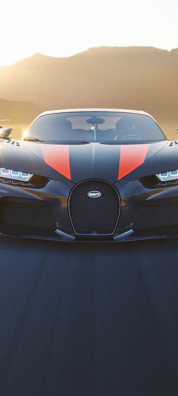 Bugatti Chiron Sport drives into sunset on open road