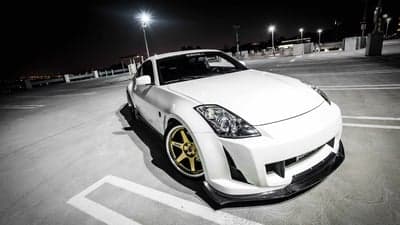 White Nissan 350Z Sports Car Night Rooftop Wallpaper