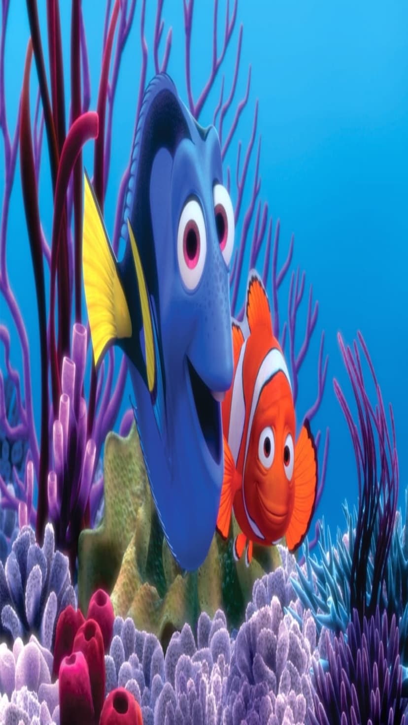 Nemo the clownfish and Dory the blue tang swim past purple sea anemones and pink coral in a clear blue ocean.