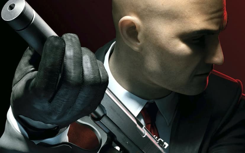 Agent 47 in a black suit holds a silver suppressed pistol against a dark red and black shaded background.