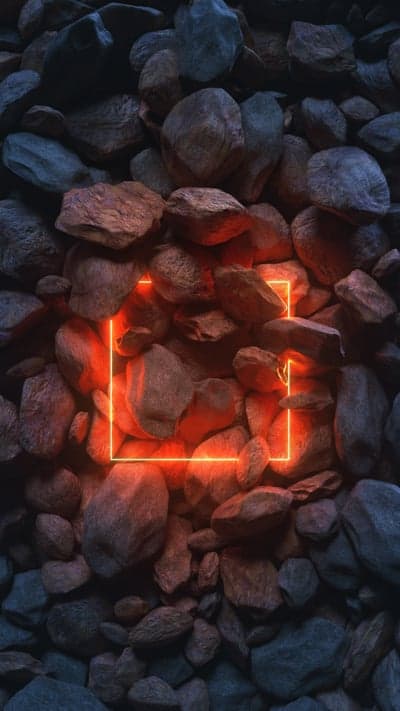 Glowing Neon Square Amidst Rough Rocks