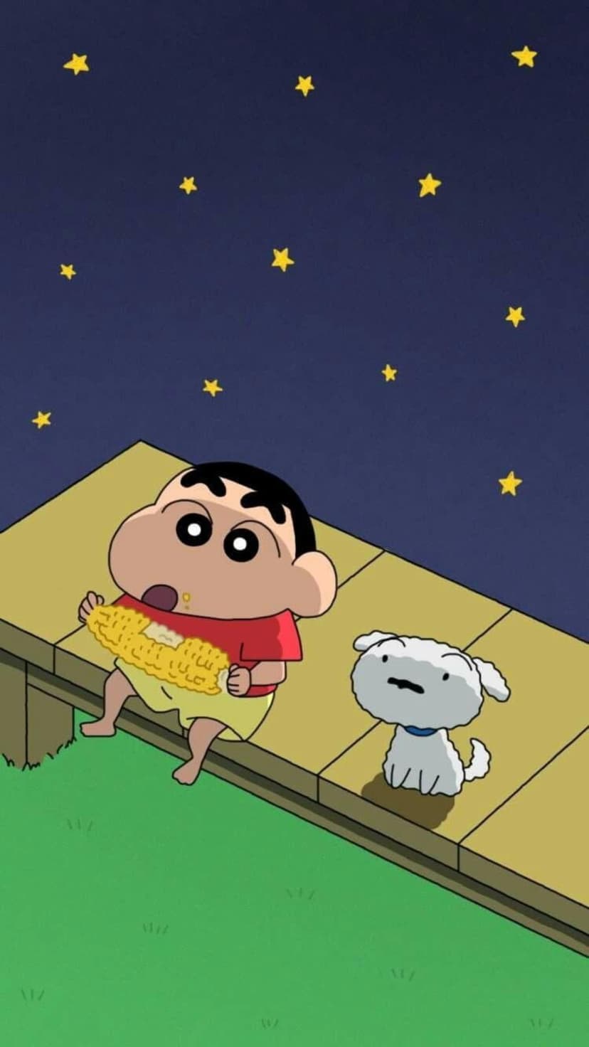 Shin-chan and Shiro eat corn on a wooden deck while looking at a dark blue sky filled with bright yellow stars.