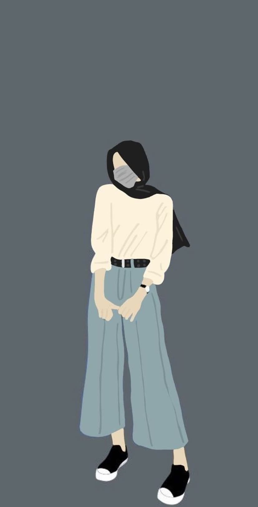 Woman wearing a black hijab and blue wide-leg pants stands against a solid grey background wearing sneakers.