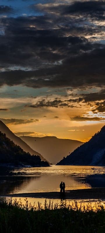 Romantic Sunset Over Serene Lake with Mountains
