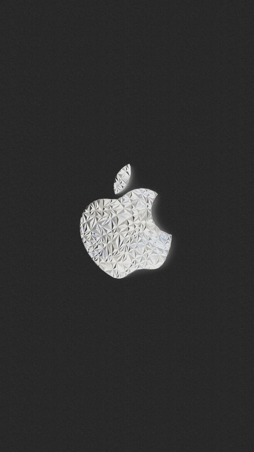 Faceted gemstone logo with reflective crystalline textures centered on a dark matte charcoal grey background.