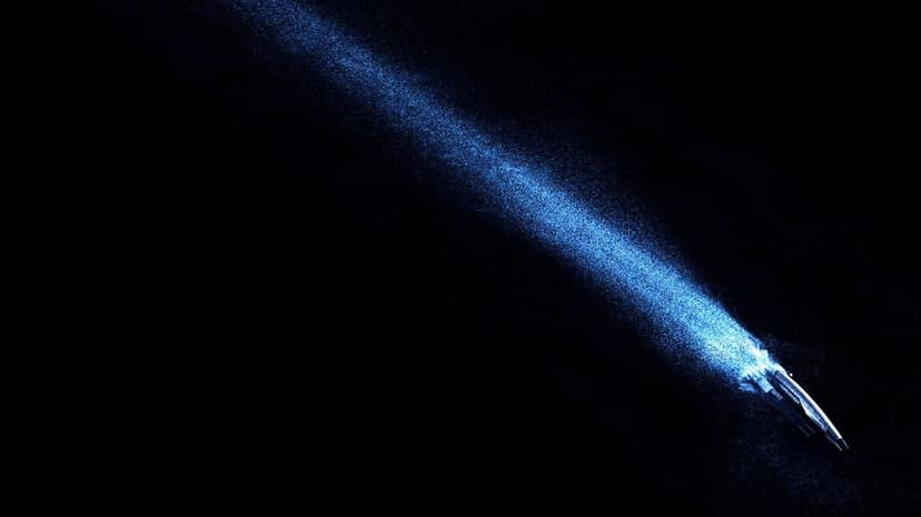 SSV Normandy SR-1 starship leaves a glowing blue particle trail against a deep black space background.