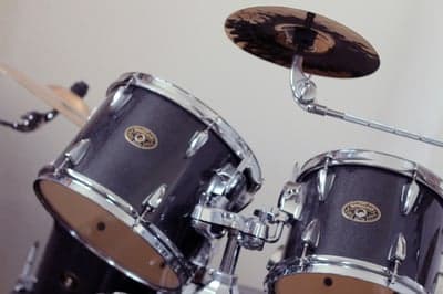 Close-up of a dark sparkle drum set with cymbal