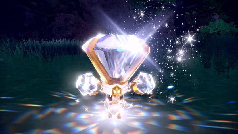 A small brown Pokemon wearing a large glowing diamond crown with rainbow light reflections on the grass.