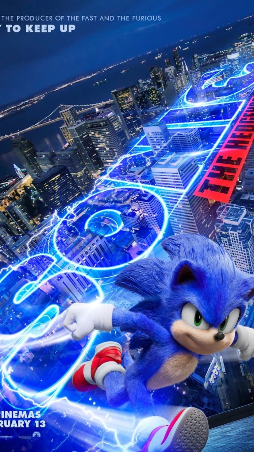 Sonic the Hedgehog sprints past city skyscrapers leaving bright blue electric trails on a movie poster background.