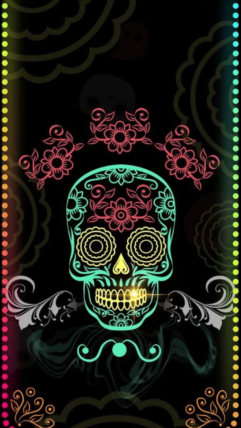 Calavera sugar skull decorated with neon pink flowers and turquoise swirls on a dark paisley background.