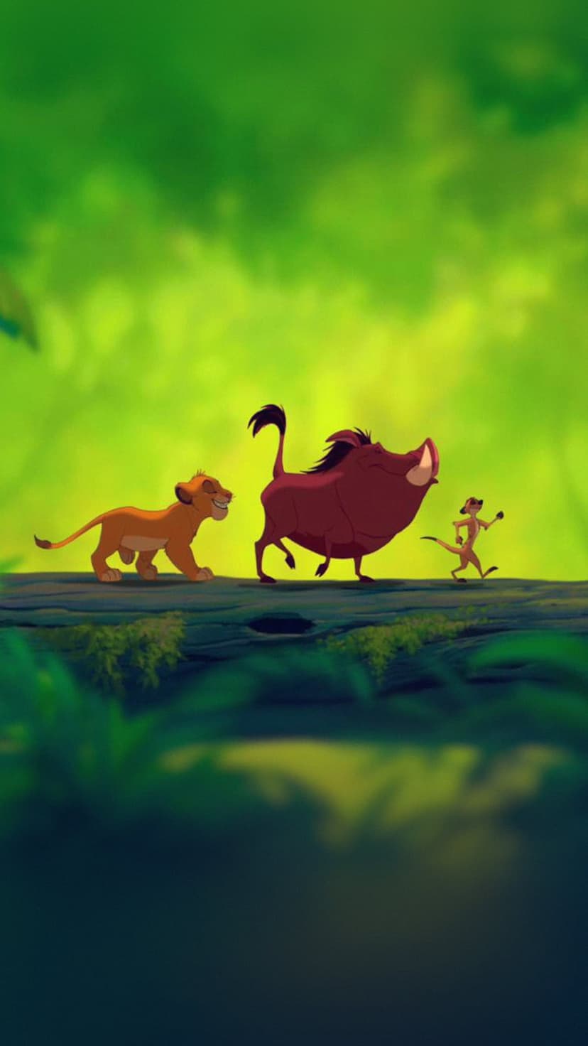 Simba, Timon, and Pumbaa walk across a fallen log in a sunlit jungle with lush green leaves and tropical plants.