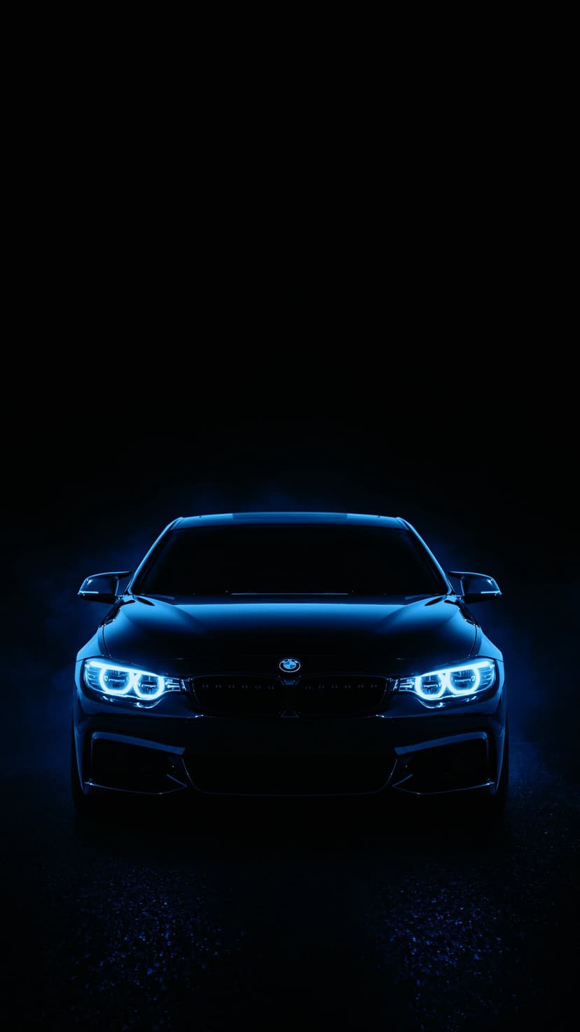BMW car front with illuminated blue LED headlights and a signature kidney grille centered in a dark black environment.