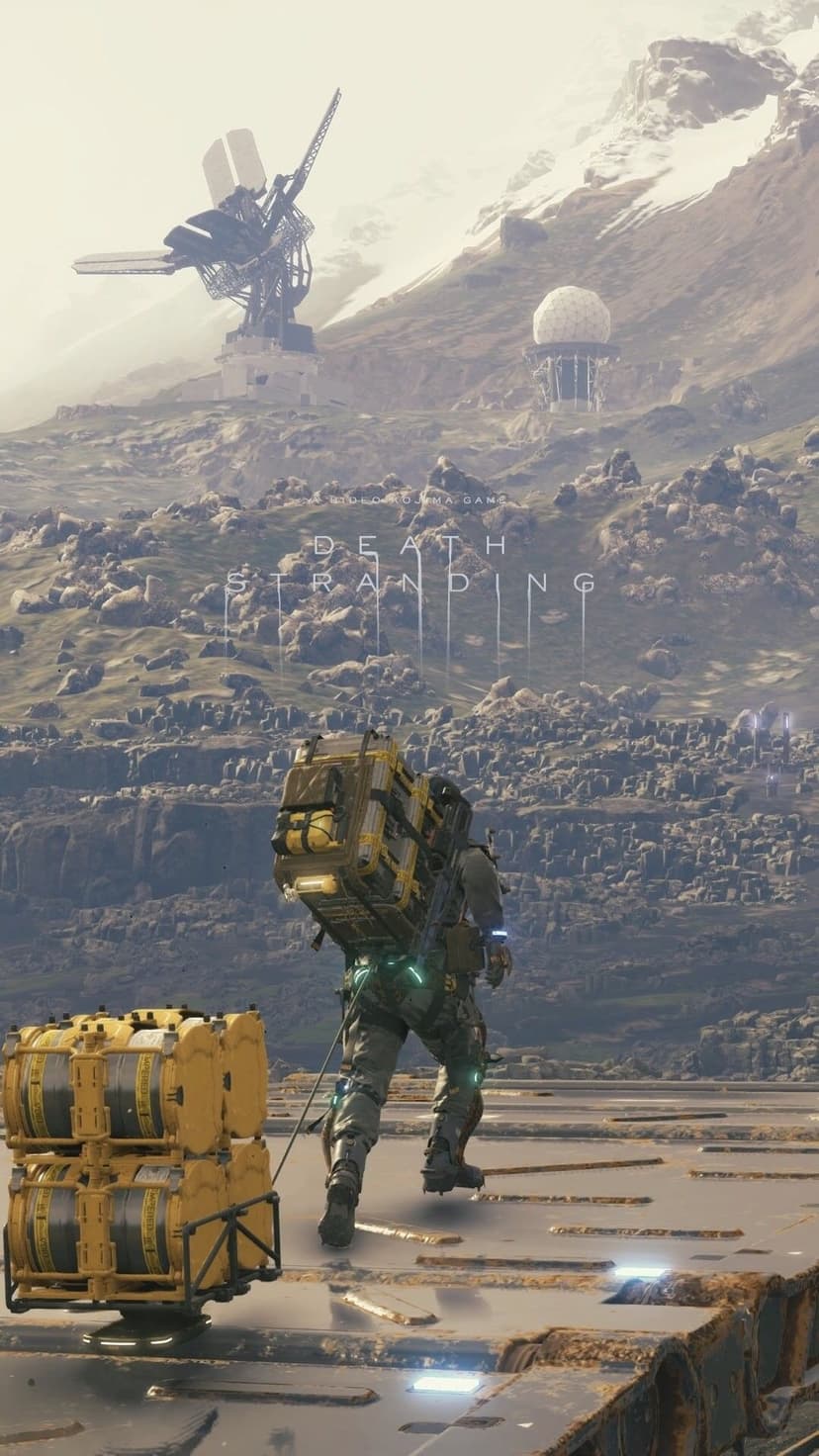 Sam Porter Bridges hauling cargo across a rocky mountain landscape with futuristic towers under a hazy, overcast sky.