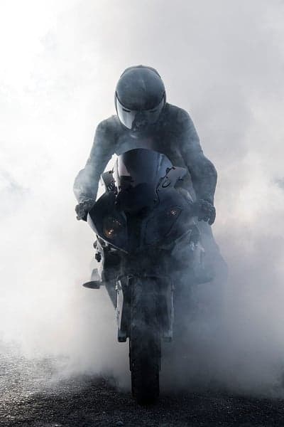 Motorcyclist in Smoke Performing a Burnout