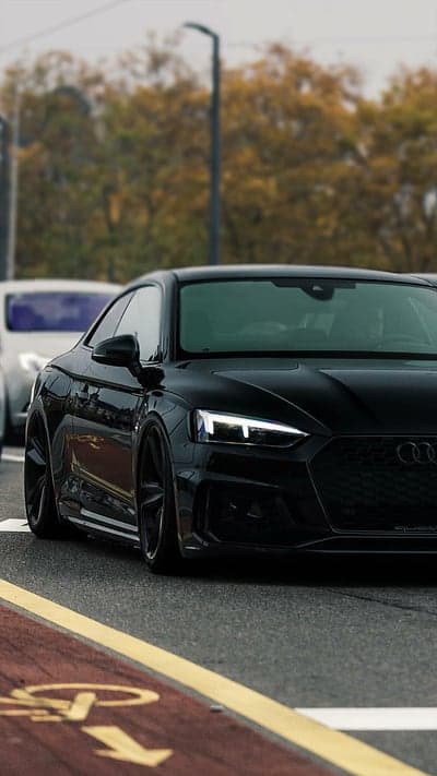 Sleek Black Audi RS5 Coupe on the Road