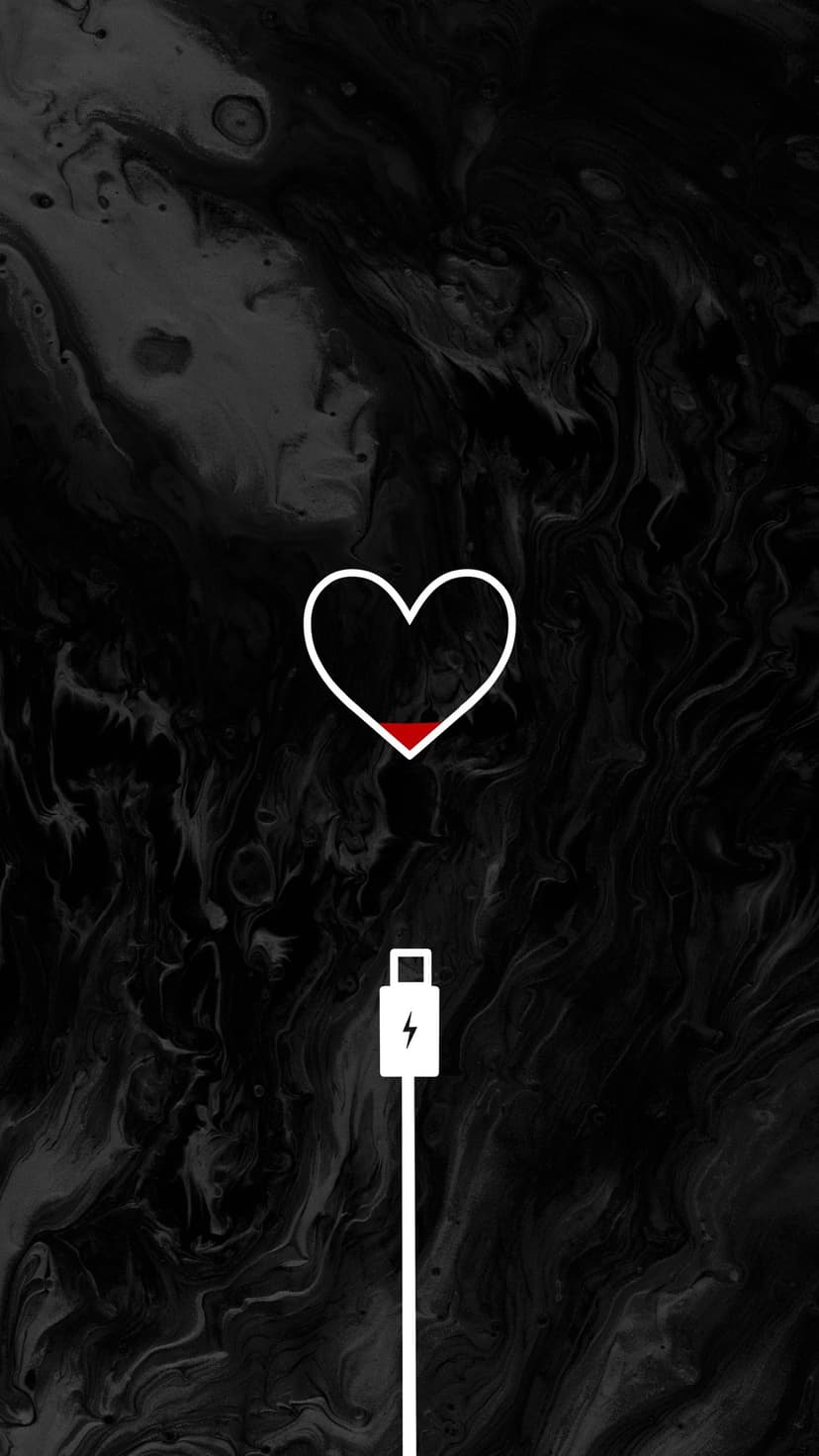 White outline heart with a red low battery bar and charging cord symbol on a dark textured background.