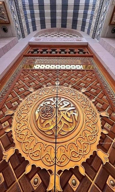 Intricate Islamic Calligraphy on Grand Wooden Mosque Doors