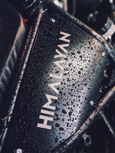 Rainy Himalayan Motorcycle Logo Close-up
