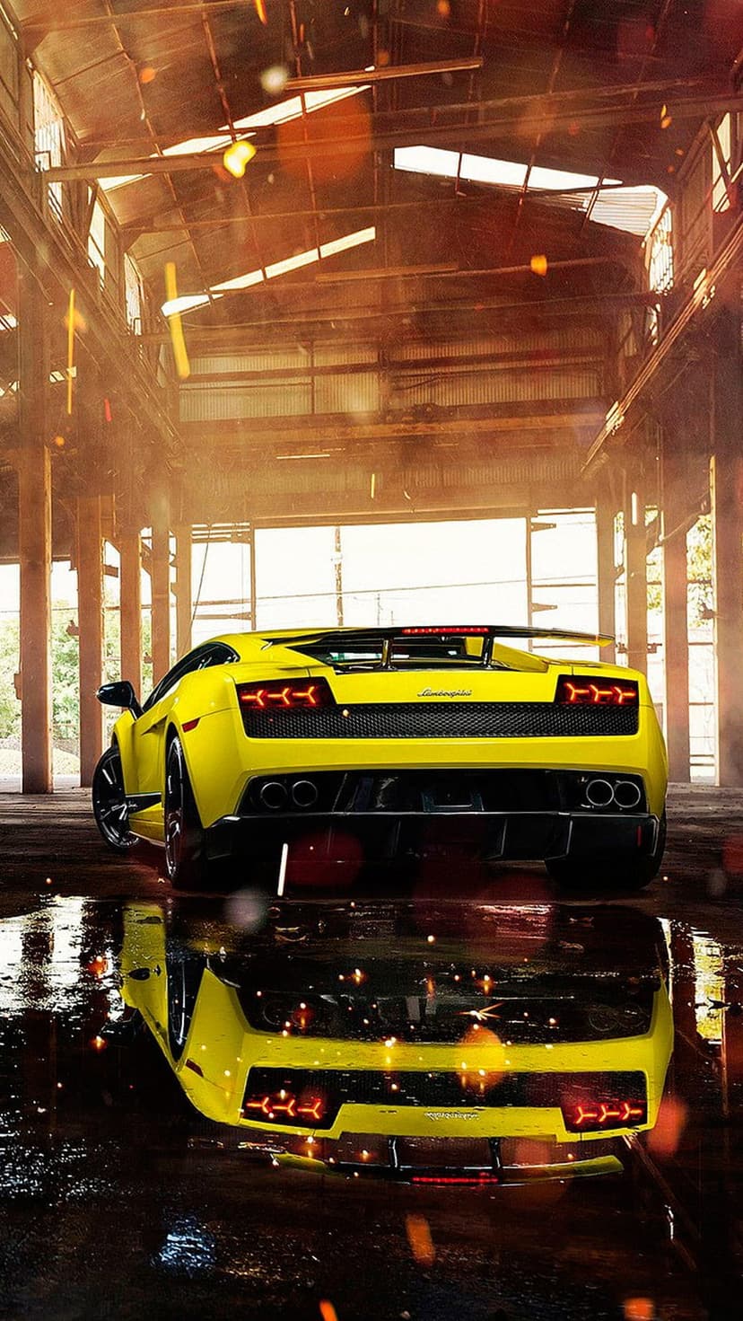 Yellow Lamborghini supercar parked on a wet warehouse floor with golden reflections and floating light sparks.