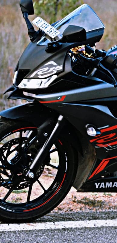 Black Yamaha R15 Motorcycle Front View with Red Accents