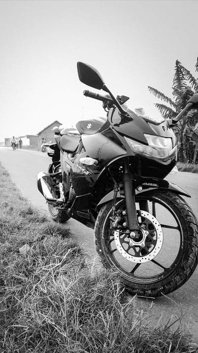 Black Suzuki Sportbike Rural Roadside Mobile Wallpaper